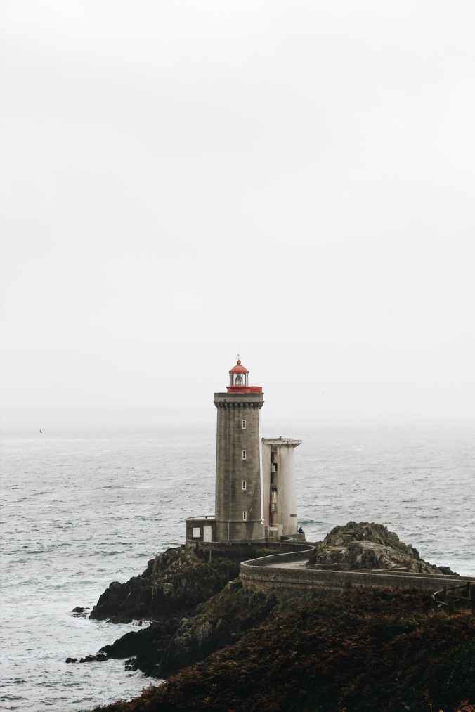 photo of lighthouse on seaside during daytime
